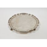 Silver salver in Georgian-style, having raised Chippendale border and on four scroll feet,