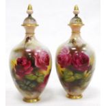 Pair of early 20th century Royal Worcester Hadley Ware oviform vases and covers, printed green