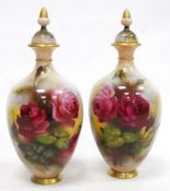 Pair of early 20th century Royal Worcester Hadley Ware oviform vases and covers, printed green