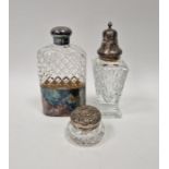 Cut glass hip flask with silver-plated cup and lid, a silver-mounted cut glass sugar caster and a
