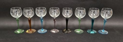 Harlequin set of hock glasses, each cup shaped bowl, coloured stem and foot in turquoise, brown,
