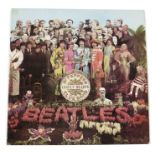 The Beatles 'Sgt Pepper's Lonely Hearts Club Band' vinyl LP, 1st pressing, mono 1967, with red on