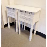 Pair of white painted bedside chests, each with two drawers and fret carved frieze