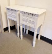 Pair of white painted bedside chests, each with two drawers and fret carved frieze