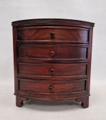 Past Times mahogany bowfronted jewellery chest of four drawers, on bracket feet