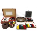 Roulette wheel, games compendium in case and four various sets of poker chips (6)