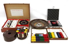 Roulette wheel, games compendium in case and four various sets of poker chips (6)