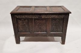 18th century oak coffer having three panelled front and carved frieze, on stile feet, 67cm x 100cm x