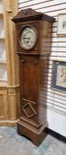 Early 20th century oak cased grandmother clock, the round convex glass door revealing silvered