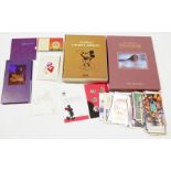 Collection of Walt Disney related ephemera including commemorative coin sets for 90 years of