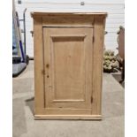 19th century pine hanging corner cupboard enclosed by a panelled door, 85cm x 55cm x 42cm
