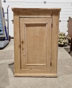 19th century pine hanging corner cupboard enclosed by a panelled door, 85cm x 55cm x 42cm