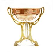Art Nouveau copper centrepiece bowl on brass stand, circa 1900, the bowl with a band of pierced