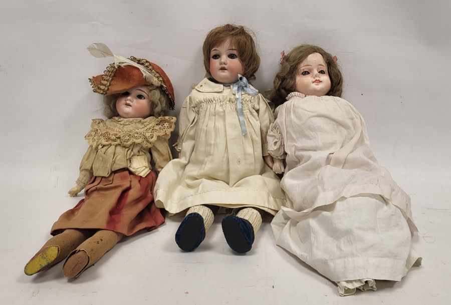 Three early 20th century dolls, comprising: an Armand Marseille (German...