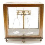 Cased set of early 20th century Griffin & Tatlock Limited chemist's precision beam scales, bearing