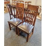 Pair of stained hardwood modern high back dining chairs with leather upholstered pad seat