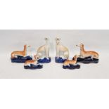 Group of late 19th century Staffordshire pottery models of greyhounds comprising a pair seated