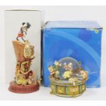 Four Disney snow globes to include Snow White Rocking snow globe playing 'I Whistle a Happy Tune,