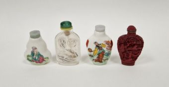 Four Chinese snuff-bottles and stoppers, comprising: a reverse glass painted snuff-bottle