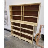 Two cream painted open bookshelves, 90cm high x 161cm wide x 24cm deep and 98cm high x 144cm wide