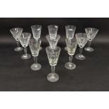 Five Waterford large cut glass wine glasses, etched marks, with lappet-cut conical bowls on