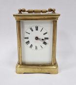 Gilt brass carriage clock in corniche case, having white enamel dial, Roman numerals, 15cm high over