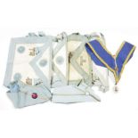 Collection of Masonic aprons and collars, mid 20th century, white kid leather edged in pale blue