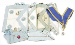 Collection of Masonic aprons and collars, mid 20th century, white kid leather edged in pale blue