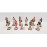 11 late 19th/early 20th century Indian painted terracotta and plaster figures of street sellers