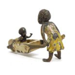 Late 19th/early 20th century cold painted bronze figure group, depicting a lady pushing a child