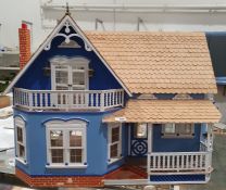 20th century painted wooden doll's house, with shingle roof and simulated brick chimney, with