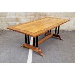 Empire-style mahogany inlaid and banded draw-leaf dining table, raised on two rows of four