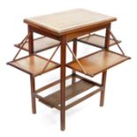 Edwardian oak metamorphic side table with revolving and unfolding top and four pull-down shelves,