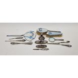 Hallmarked silver squat candlestick, 6cm high, a selection of silver-handled dressing items