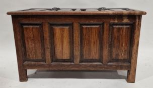Reproduction stained pine blanket chest having a four panelled cover and front, iron hinges, on