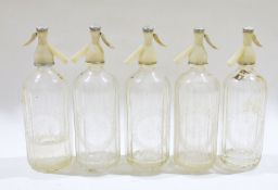 Five vintage Schweppes soda syphons, each bearing the etched brand, of typical fluted form, 30cm