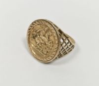 Gent's 9ct gold signet ring set with a St George medal with pierced decoration to the shank, 4.5g (