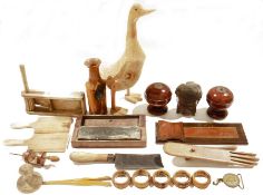 Assorted items of treen including a yew wood vase by William Stanley, 1991, assorted napkin rings, a