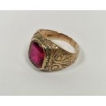 Gent's 9ct gold signet ring set with a single emerald cut red stone, with engraved decoration to the