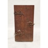 Antique iron-bound oak cabinet, the door with scroll hinges opening to sliding shelves and small