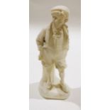 Carved marble figure of an urchin holding stick under his arm, 37cm high