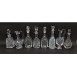 Collection of decanters and claret jugs including a St Louis claret jug, a pair of kicked-in style