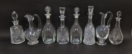 Collection of decanters and claret jugs including a St Louis claret jug, a pair of kicked-in style