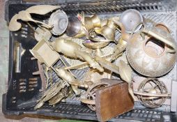 Quantity of brass and copperware to include embossed brass trays, copper jugs, a brass model of a