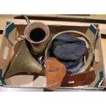 Brass horn, a brass and copper jug, two black peaked caps, a vintage brass-bound mahogany wooden