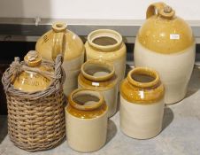 Seven stoneware flagons and jars, some marked, to include The Stroud Brewery Company Limited, J