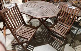 Octagonal wooden garden table and four folding wooden chairs (5)