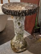 Composite stone bird bath, the pedestal in the form of a tree trunk, 68cms h.