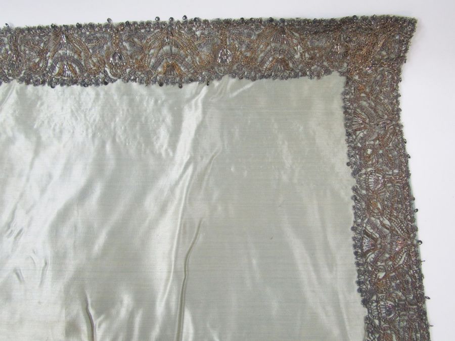 Length of 17th century silver and silver-gilt lace as a border, 6cm wide, on pale blue silk cloth, - Image 9 of 24