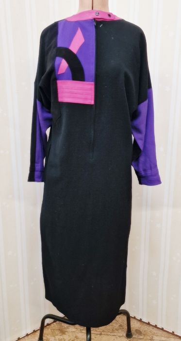 A black wool crepe dress with pink leather, black velvet and black leather detail labelled "Anne - Image 9 of 16